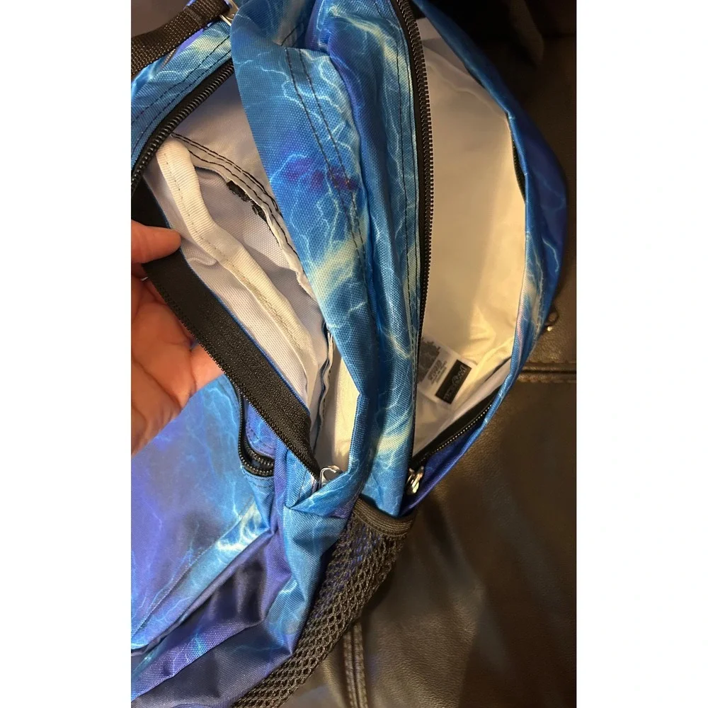 NWOT JanSport Back Pack, Blue Lightening. Multi Zip Pockets